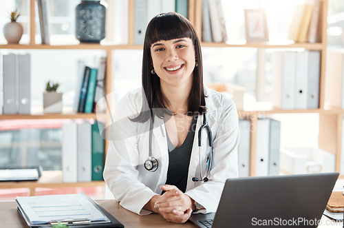 Image of Doctor, portrait and smile of woman in hospital office ready for healthcare and wellness. Medical professional, health and happy female physician from Canada with laptop for research and telehealth.