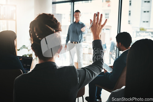 Image of Businessman, coaching and presentation with audience in FAQ, answer or leadership at office workshop. Male leader speaking in staff training with hand raised for marketing, planning or strategy idea