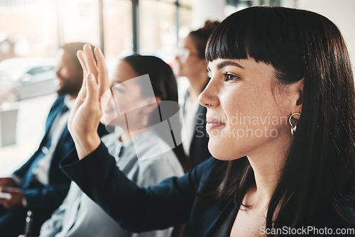 Image of Business people, hand and audience in question, presentation or answer at office workshop. Woman with hands raised in staff training for marketing, planning or idea for team strategy in crowd seminar