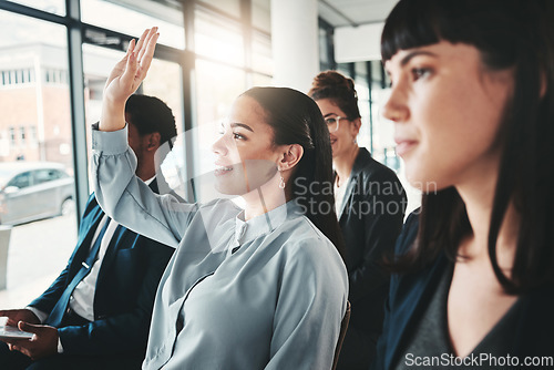 Image of Question, workshop and woman in meeting, conference or seminar in office corporate training session. Vote questions, group audience or business people or employee with hand up for learning new skills