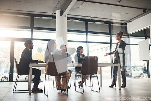 Image of Business woman, coaching and meeting in conference for idea or leadership at office workshop. Female leader, coach or mentor speaking in staff training for marketing, planning or corporate strategy