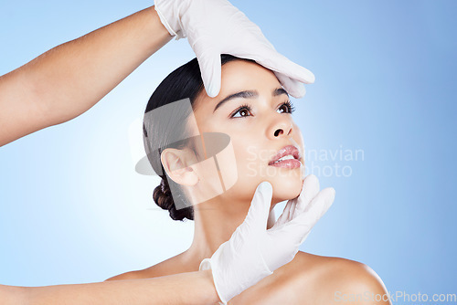 Image of Face, plastic surgery and doctor hands on woman for beauty, filler and change in studio. Aesthetic model person and surgeon for cosmetic facial transformation or dermatology on gradient background