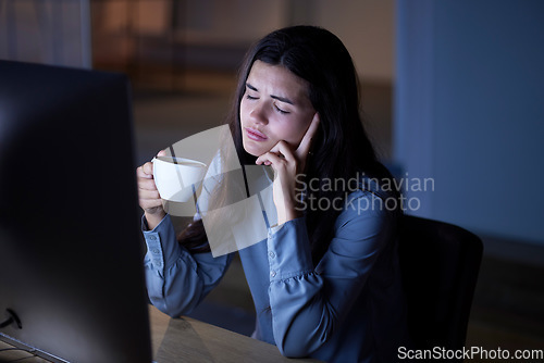 Image of Night, coffee and exhausted with woman in office for deadline, burnout and overtime goals. Stress, headache and mental health problems with employee at computer for research, overworked or frustrated