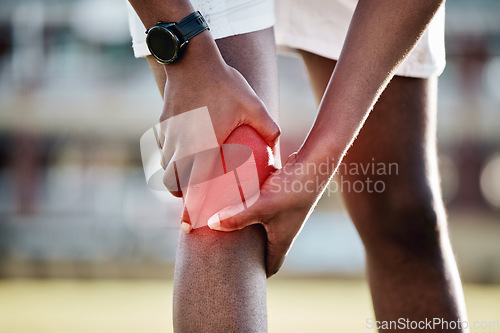 Image of Injury, inflammation and man with knee pain from sports, fitness accident and injured muscle. Symptom, emergency and athlete holding his leg after a sprain, swollen joint and workout strain on body