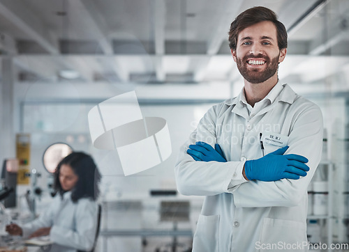 Image of Scientist, portrait and man in lab with science and research for medical innovation or biotechnology with chemistry. Scientific study, doctor in laboratory with leadership and arms crossed