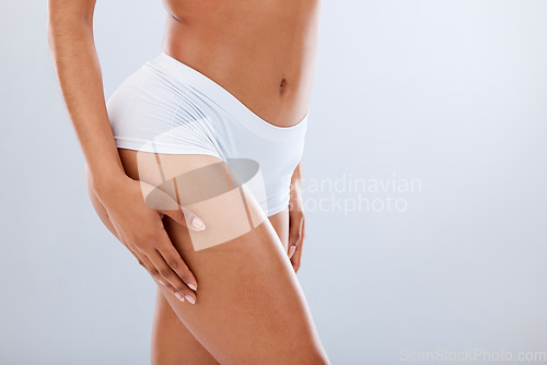 Image of Body, beauty and black woman thigh with mockup, health and diet with skin glow. Isolated, white background and studio with model after leg cellulite, liposuction and cosmetic treatment with mock up