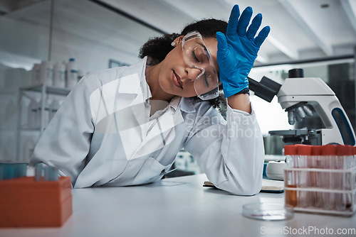 Image of Tired woman, doctor and scientist sleeping with headache at night suffering from burnout or overworked at lab. Exhausted female in science research, stress or asleep while working late in laboratory