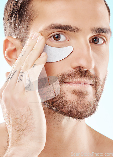 Image of Eye, beauty mask and portrait of a man with dermatology cosmetics with collagen benefits for skin. Aesthetic model person with gel patch for skincare, self care and spa facial for health and wellness