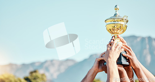 Image of Sports, win and hands of a team with a trophy for an achievement, goal and success together. Gold, winner and people holding an awards cup after winning a sport competition or rugby tournament