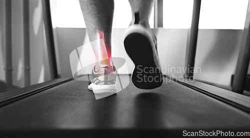 Image of Closeup, treadmill and ankle with pain, injury and muscle tension with person walking, exercise and training. Zoom, athlete or foot with red highlight, gym equipment or strain after practice and ache