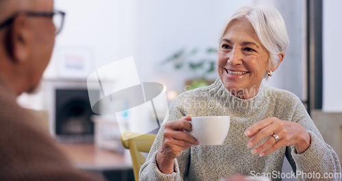 Image of Smile, retirement and a senior couple drinking tea in the dining room of their home together in the morning. Love, relax or conversation with an elderly man and woman in their apartment for romance