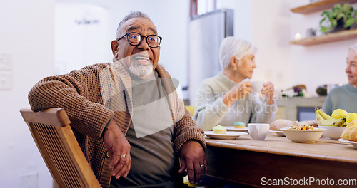 Image of Retirement, tea party and a group of senior people in the living room of a community home for a social. Friends, smile or conversation with elderly men and women together in an apartment for a visit