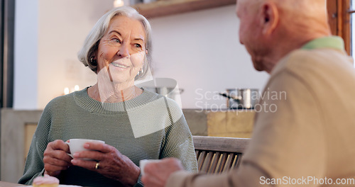 Image of Love, retirement and an elderly couple drinking tea in the dining room of their home together in the morning. Smile, relax or coffee conversation with a senior man and woman in apartment for romance