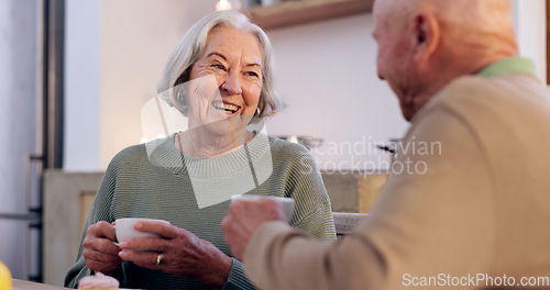 Image of Funny, retirement and a senior couple drinking tea in the dining room of their home together in the morning. Smile, relax or laughing with an elderly man and woman in apartment for romance and coffee