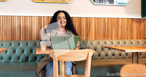 Image of Happy woman in cafe, typing on laptop and remote work, reading email or writing blog, article or search on technology. Computer, freelancer or copywriting in coffee shop, store or restaurant at table