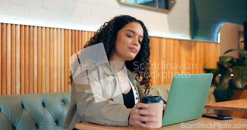 Image of Woman, coffee and laptop in cafe for remote work, research or networking for business with web. Face, person and reading with technology in restaurant for copywriting, internet and freelancer