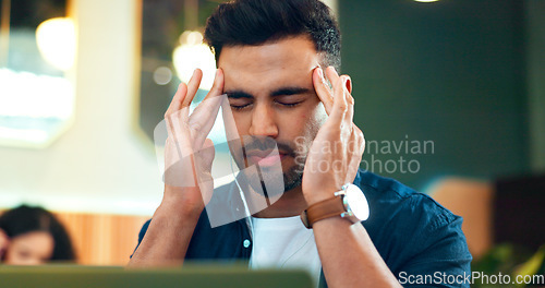 Image of Man, headache and pain on laptop at cafe of online research, planning and remote work stress or mistake. Frustrated freelancer or writer with migraine, mental health risk and tired in a restaurant