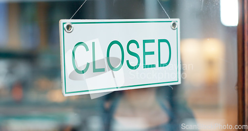 Image of Front door, small business or closed sign on window in coffee shop or restaurant for end of service. Closing time, diner or glass with board, poster or message in retail store or cafe for notice