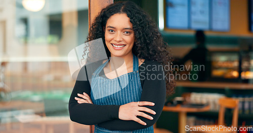 Image of Businesswoman, coffee shop and arms crossed with smile, manager and startup for store, cafe or restaurant. Portrait, entrepreneurship or waitress for retail, proud or confident at door, happy or open