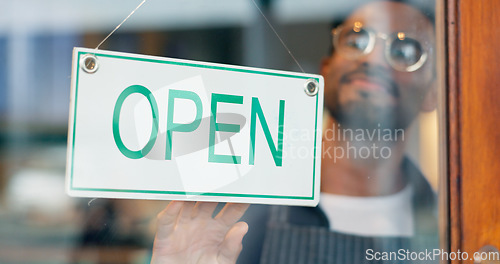 Image of Man, small business or open sign on door in coffee shop or restaurant for service or advertising. Ready, start or entrepreneur holding board, poster or welcome for message on window in diner or cafe