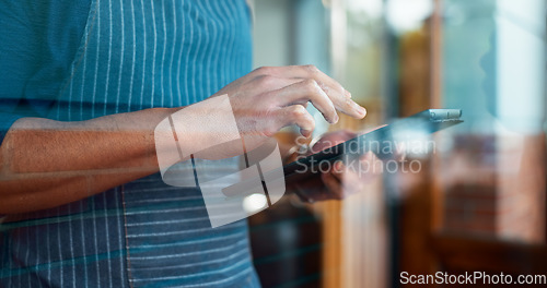 Image of Hands, restaurant or barista on tablet for small business owner, social media update or sale promotion. Waiter, scroll closeup or person reading on technology app for coffee shop order on cafe review