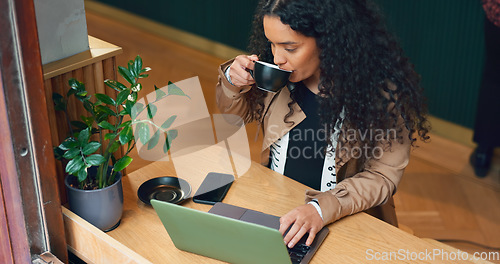 Image of Woman, remote work and coffee shop with laptop, drink and scroll with reading, data analysis or thinking. Journalist, freelancer and ideas with computer, cafe or process for story, news or research