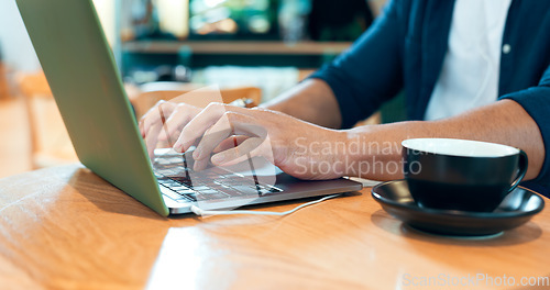 Image of Hands typing, computer and coffee shop for remote work, online research and planning for marketing project. Person, customer or freelancer at cafe or restaurant with internet, laptop and copywriting