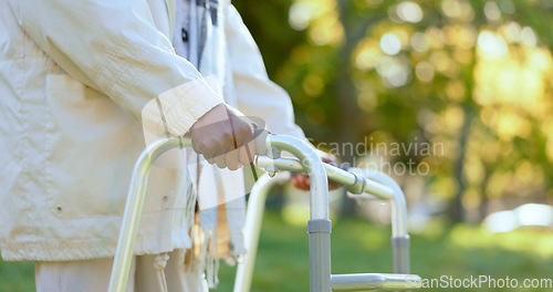 Image of Hands, walking frame and a senior person in a garden outdoor in summer closeup during retirement. Wellness, rehabilitation or recovery and an elderly adult with a disability in the park for peace