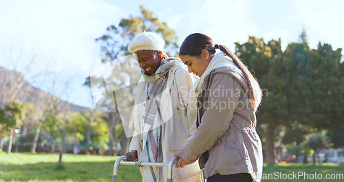 Image of Senior care, old woman with walker and nurse in park with support, help or trust at nursing home. Retirement healthcare, elderly person and happy caregiver walk and talk in garden together with smile