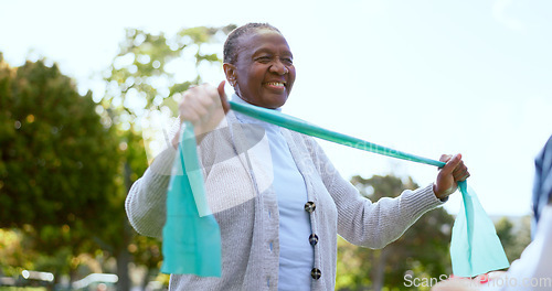 Image of Elderly, woman and physiotherapy for fitness with resistance band in park, outside or garden for wellness. Black person, smile and happy with results in mobility, recovery or rehabilitation of injury