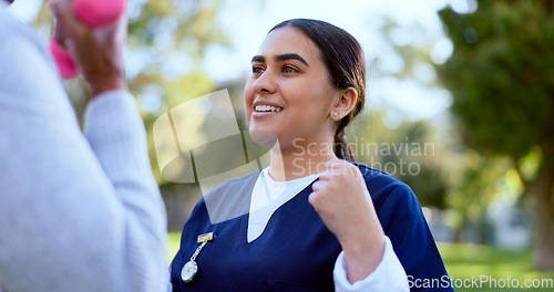 Image of Hands, caregiver and dumbbell outdoor for exercise, workout or fitness in a park with happiness. People, professional or nurse with support for physiotherapy, wellness and health in nature