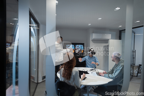 Image of A diverse group of businessmen collaborates and tests a new virtual reality technology, wearing virtual glasses, showcasing innovation and creativity in their futuristic workspace