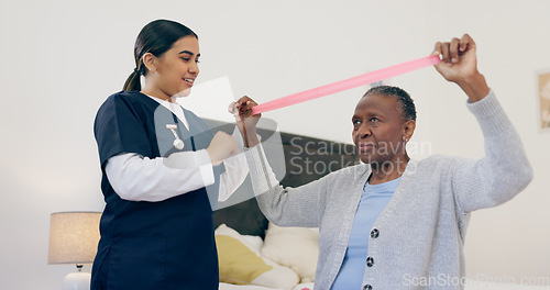 Image of Senior woman, caregiver and band for exercise in house, physiotherapy help or wellness workout support. Nurse, elderly patient or healthcare in retirement, trust or physical therapy for health body