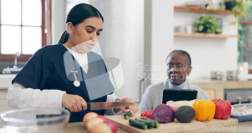 Image of Nurse, cooking and senior woman in home with healthy food, vegetables and nutrition in healthcare. Retirement, caregiver and helping elderly person in kitchen with diet and online recipe on tablet