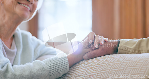 Image of Support, love and senior couple holding hands in conversation in the living room at home. Discussion, affection and closeup of elderly man and woman in retirement with comfort in lounge at house.