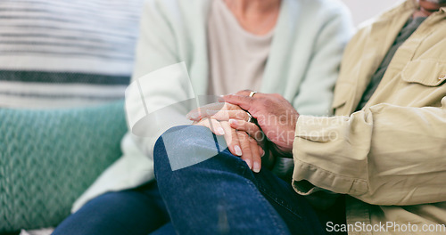 Image of Love, closeup and senior couple holding hands in living room at home for marriage together. Support, comfort and elderly man and woman with affection for relationship in the lounge at modern house.