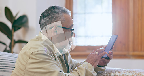 Image of Relax, home and senior man with a smartphone, internet and connection with social media in a lounge. Mature person, elderly guy and pensioner with a cellphone, digital app and communication with text