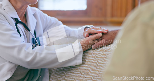 Image of Support, care and doctor holding hands with patient for medical diagnosis or treatment planning. Consulting, career and closeup of healthcare worker comforting a man in living room of nursing home.