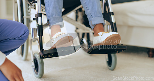 Image of Feet, wheelchair and nurse with help in home for recovery, assessment and check progress for healthcare. Physiotherapist, doctor or caregiver for person with disability in house for rehabilitation