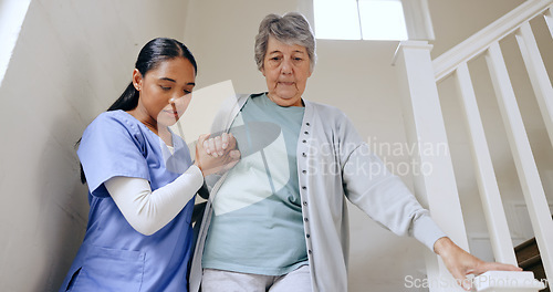 Image of Senior woman, nurse and help on stairs, retirement home and caregiver for support, trust and nursing. Careful, empathy and elderly for healthcare, injury and disability for patient, respect and job