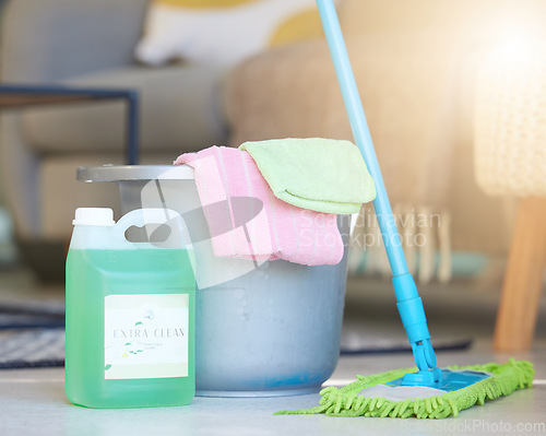 Image of Cleaning, soap detergent product and bucket with mop for domestic work, household chores and sanitizing house to get rid of germs, bacteria and dirt. Clean living room, shiny floor and spotless house