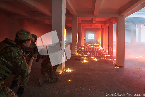 Image of A professional cameraman captures the intense moments as a group of skilled soldiers embarks on a dangerous mission inside an abandoned building, their actions filled with suspense and bravery