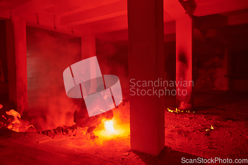 Image of A professional cameraman captures the intense moments as a group of skilled soldiers embarks on a dangerous mission inside an abandoned building, their actions filled with suspense and bravery