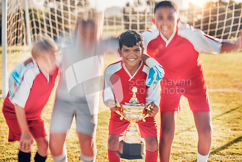 Image of Trophy, soccer and team in celebration of success as winners of a sports award in a childrens youth tournament. Happy, goals and young soccer players celebrate winning a kids football championship