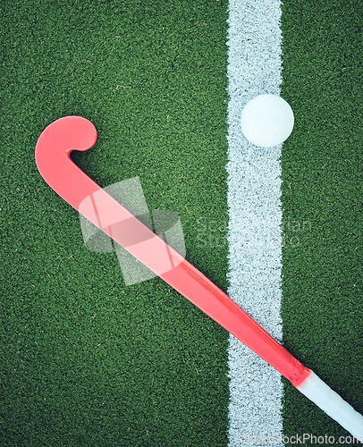 Image of Turf field, stick hockey and sports ground for game, competition and training gear. Green pitch or grass flatlay at a sport event with workout, exercise or athlete equipment and ball on a playground