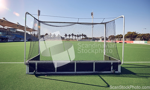 Image of Field turf, hockey goals and sports stadium for fitness contest, training game or outdoor competition exercise. Green pitch, astroturf grass and field hockey arena for health workout, match and score