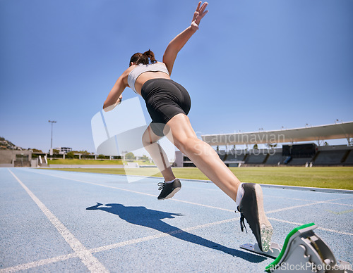 Image of Woman track runner, start running and sprint training for race exercise, fitness workout and using starting blocks for speed. Competitive sports athlete, fast sprinter and girl exercising for cardio