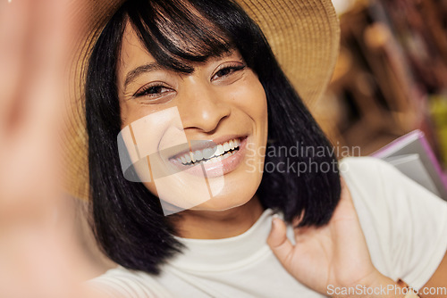 Image of Black woman shopping, selfie and happy face at a store feeling young and relax with a smile in the sun. Portrait of a person in New York with retail happiness and content lifestyle on a summer day