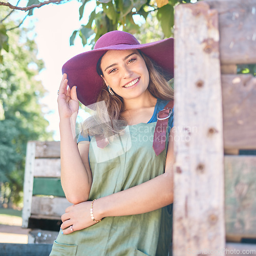 Image of Countryside, farming trees and farmer woman for agriculture, sustainability and summer harvest lifestyle with portrait. Supplier, seller or business owner with fruit tree for food production industry