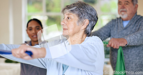 Image of Rehabilitation, recovery or resistance band and a senior people in their home with a personal trainer. Fitness, physiotherapy or health with an elderly man and woman in their apartment for a workout